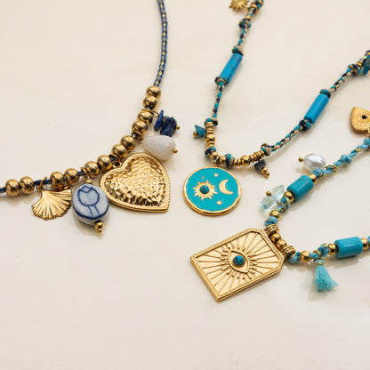 Layered boho beach necklaces with blue cords and gold beads