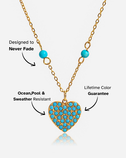 Heart-shaped turquoise pendant necklace on a gold chain with text about color guarantee and resistance.