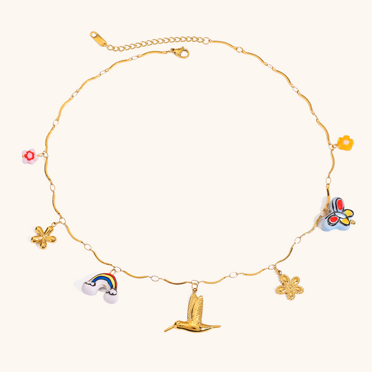 Gold necklace with rainbow, bird, clover and butterfly pendants in a colorful enamel finish