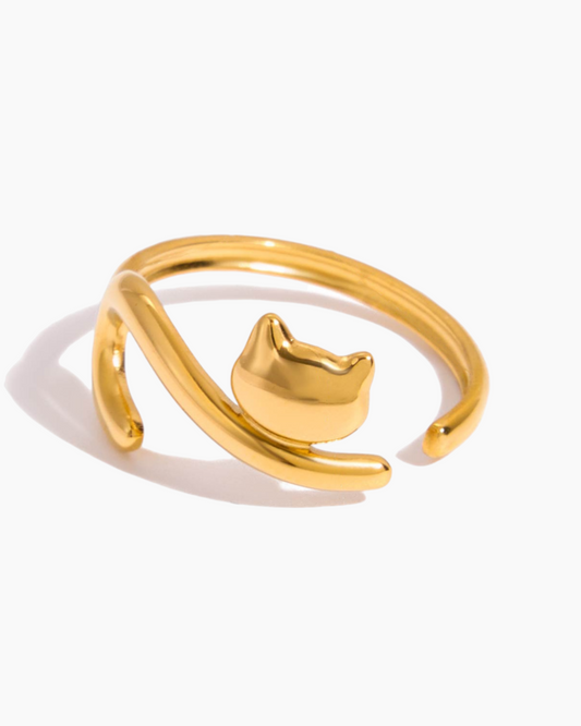 Gold cat-shaped ring on a white background