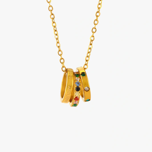 With Love Triple Ring Necklace featuring multicolor zircon stones on a stainless steel chain, perfect for adding a pop of color to any outfit.