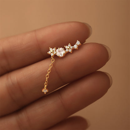 Studio image of gold plated zircon chain earrings, minimal and delicate celestial design.