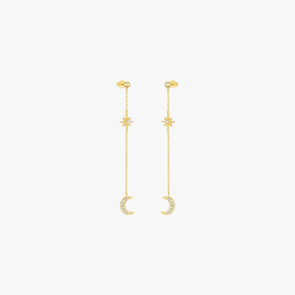 Elegant celestial moon and star earrings featuring sparkling crystals on a long chain, ideal for night sky-inspired fashion.