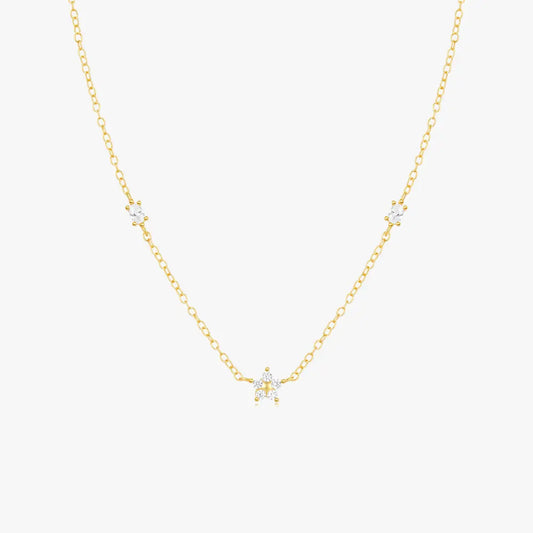 Delicate gold chain pearl necklace in minimalist style with multiple freshwater pearls.