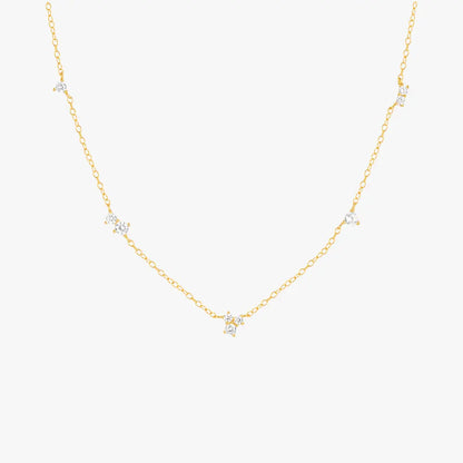 Gold necklace with delicate star-shaped charms, perfect for layering