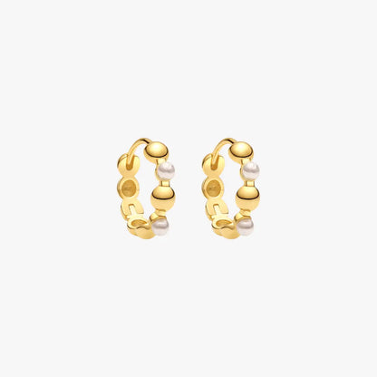 Geometric gold hoop earrings with pearls, blending modern design with classic elements.