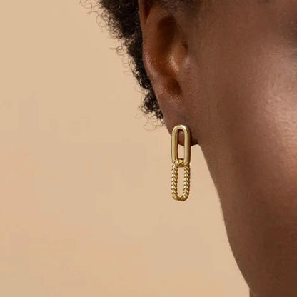 Gold chain link drop earrings on model, showcasing minimalist elegance for everyday fashion.