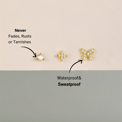Dainty 3-piece gold stud earring set, perfect for layering and stacking, featuring star, butterfly, and round CZ stones.