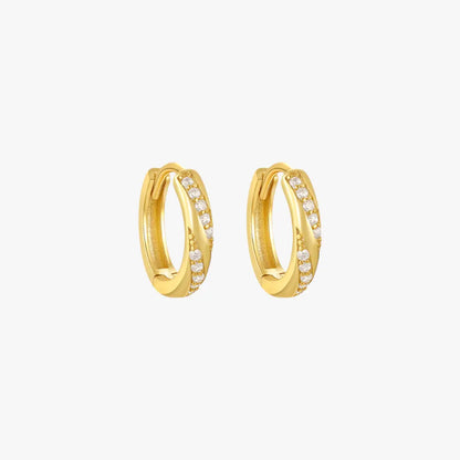 Gold diamond twist hoop earrings for women, offering a chic and contemporary design.