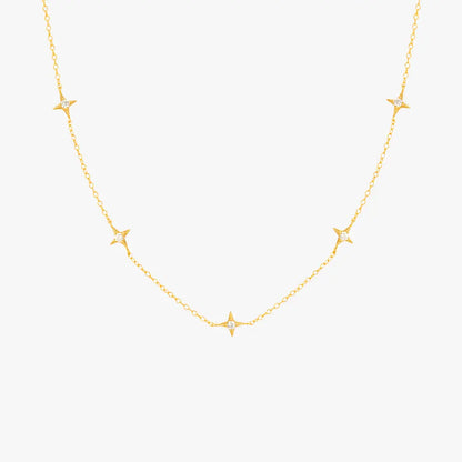 Gold necklace featuring multiple star pendants with diamonds, ideal for a celestial-inspired look.