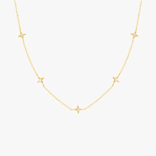 Gold necklace featuring multiple star pendants with diamonds, ideal for a celestial-inspired look.