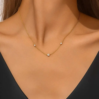 Gold pearl necklace worn by a model, showcasing elegant and timeless jewelry.