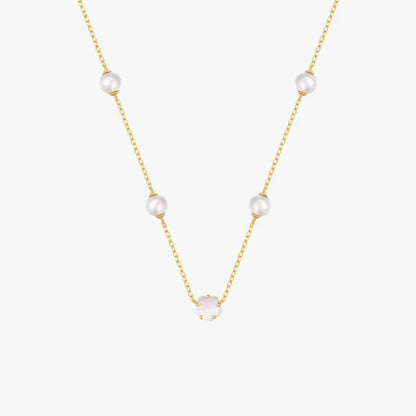 Stylish golden necklace with pearls and a white clover charm, crafted from 925 sterling silver.