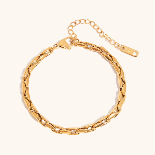Close-up of a polished gold link bracelet with adjustable clasp, ideal for stacking