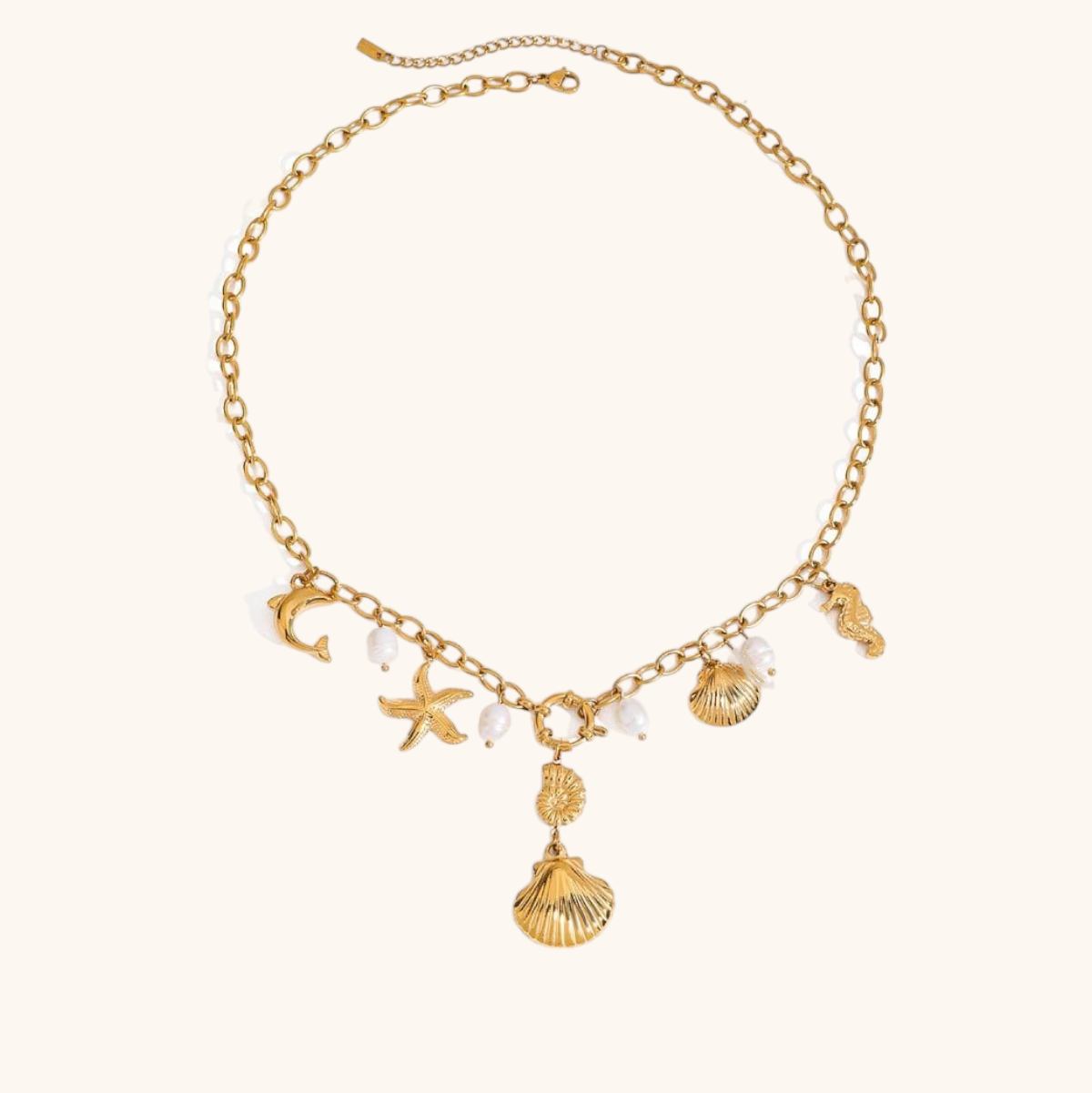 Gold seashell and starfish charm necklace with pearls on adjustable chain