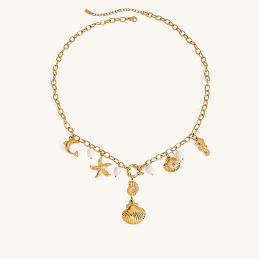 Gold seashell and starfish charm necklace with pearls on adjustable chain