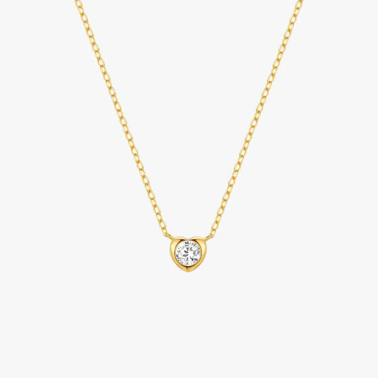 Minimalist gold heart-shaped pendant necklace with a zircon center