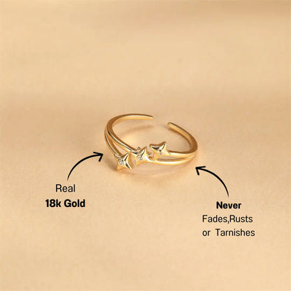 Flat lay of Sterling Silver Open Star Ring with Zircon Accents, gold finish with star details