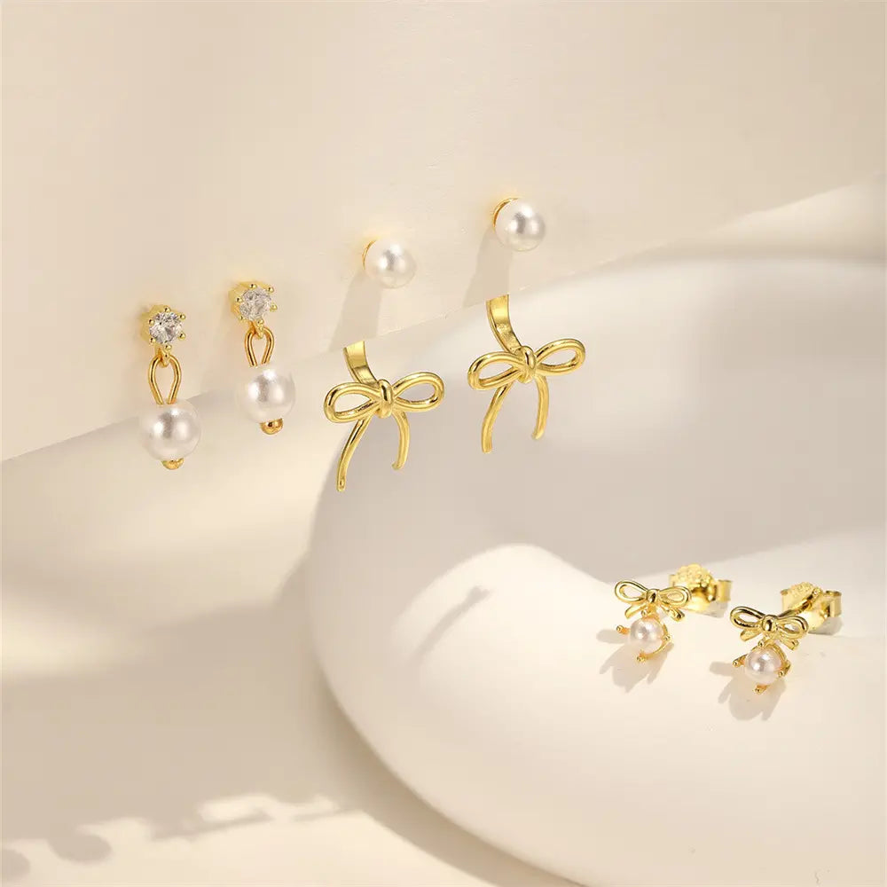 Boucles d'oreilles à tige élégantes en forme de nœud en perles